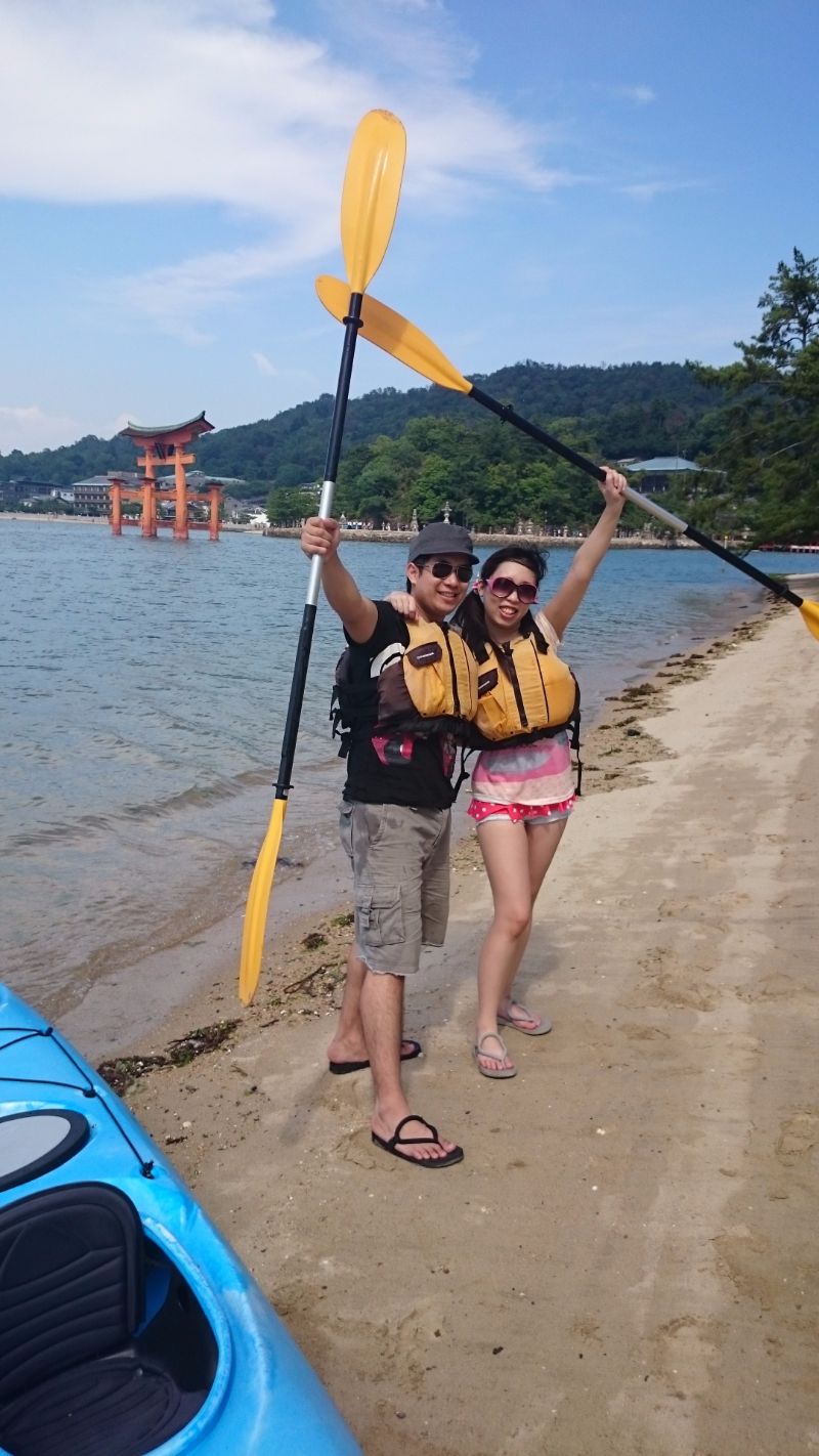 pose in front of torii